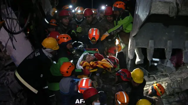 Emergency personnel carry a man from the rubble after 110 hours after a major earthquake in Nurdagi district of Gaziantep city