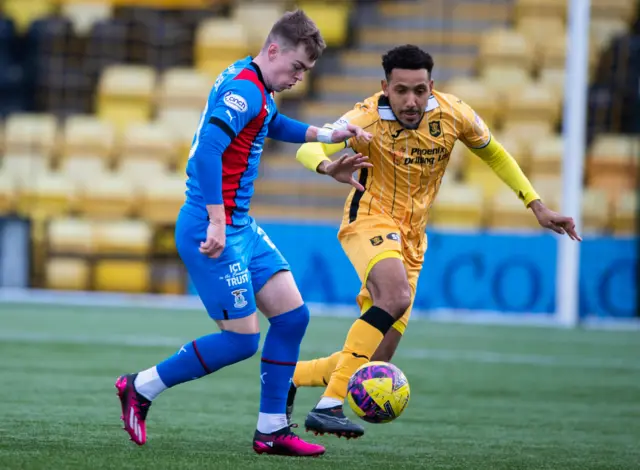 Inverness and Livingston battle for the ball