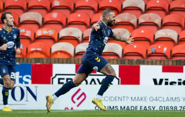 Kyle Vassell celebrates