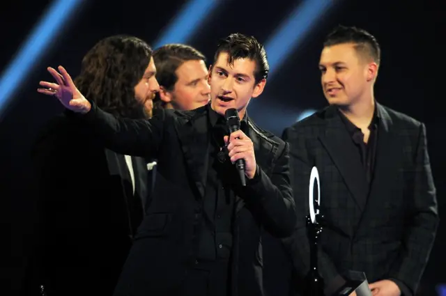 Arctic Monkeys accepting their album of the year award at the 2014 Brit Awards for AM