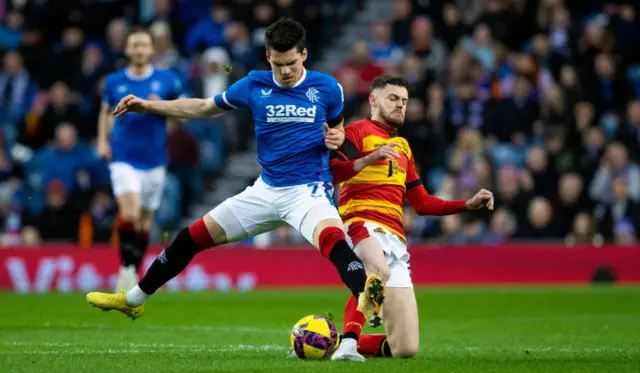 Rangers' Ianis Hagi (L) and Partick's Jack McMillan