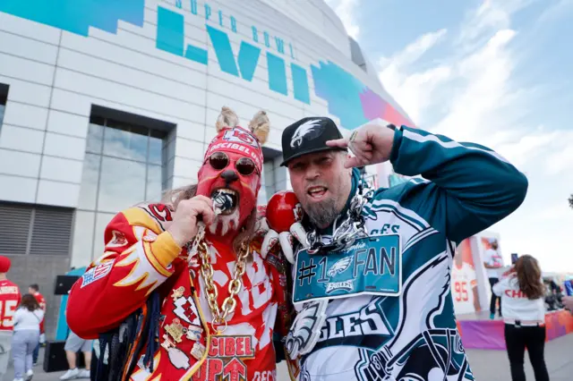 A Kansas City fan with a Philadelphia fan