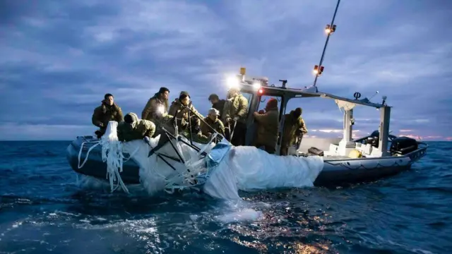 The remains of the balloon being hauled into a boat off the South Carolina coast