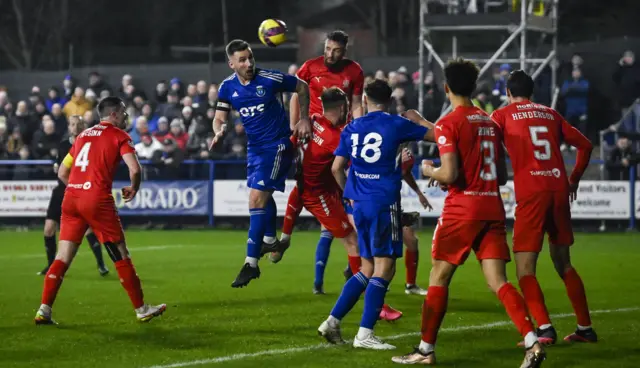 Darryl Meggatt heads towards the Falkirk goal