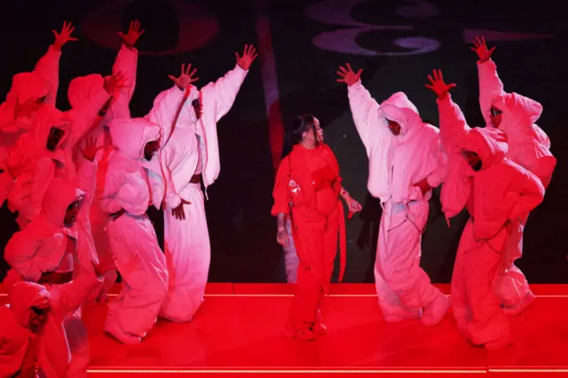 Rihanna performs with her dancers