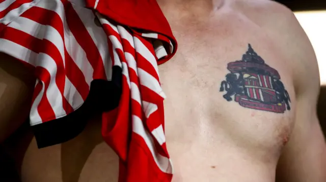 A Sunderland fan with a tattoo of the club crest