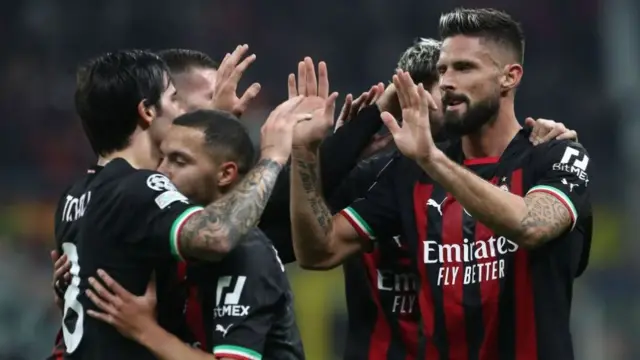 AC Milan players (including Olivier Giroud - right) celebrate