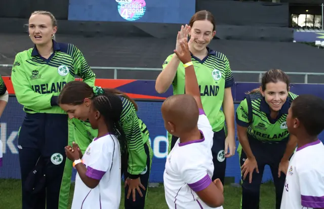 Orla Prendergast of Ireland interacts with a mascot ahead of the ICC Women's T20 World Cup group B match between Pakistan and Ireland at Newlands Stadium