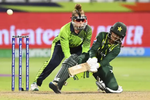 Pakistan's Muneeba Ali (R) plays a shot as Ireland's wicketkeeper Mary Waldron (L) looks on during the Group B T20 women's World Cup cricket match between Pakistan and Ireland at Newlands Stadium in Cape Town