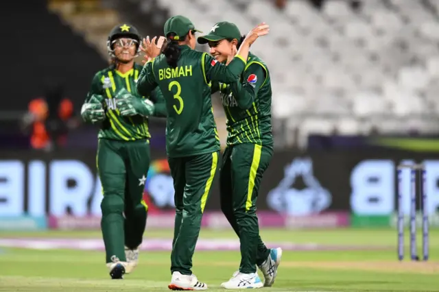 Pakistan's Bismah Maroof (C) celebrates with teammates after the dismissal of Ireland's Laura Delany (not seen) during the Group B T20 women's World Cup cricket match between Pakistan and Ireland at Newlands Stadium in Cape Town