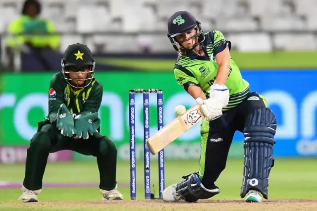 Ireland's Eimear Richardson (R) plays a shot as Pakistan's wicketkeeper Muneeba Ali (L) reacts during the Group B T20 women's World Cup cricket match between Pakistan and Ireland at Newlands Stadium in Cape Town