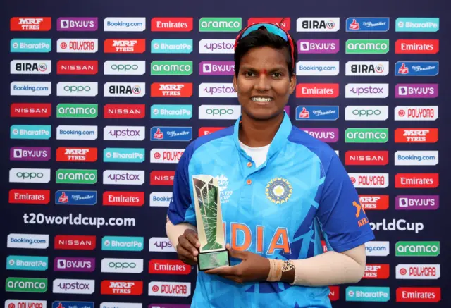 Deepti Sharma celebrates with the player of the match award