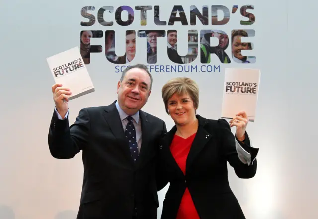 Alex Salmond and Nicola Sturgeon pictured holding copies of the White Paper - the blueprint for Scottish independence - after it was launched in 2013