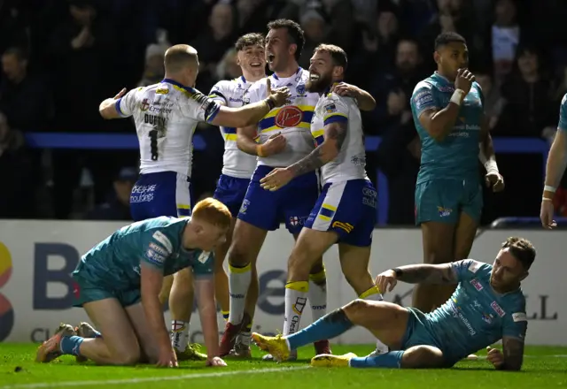 Daryl Clark celebrates scoring for Warrington