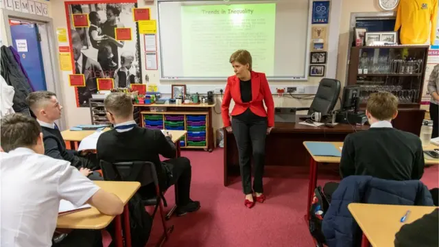 First Minister Nicola Sturgeon chatting to Glasgow pupils in a modern studies class in 2022