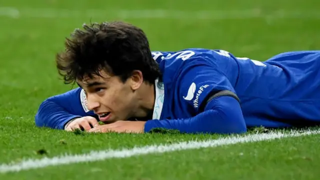 Chelsea forward Joao Felix on the floor after a miss