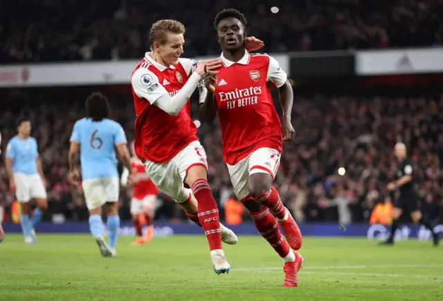 Bukayo Saka celebrates scoring for Arsenal