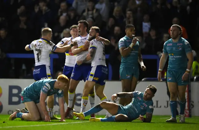 Warrington celebrate a try