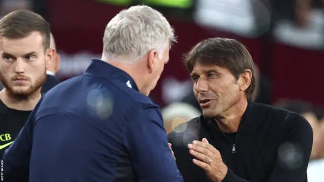 Tottenham manager Antonio Conte greets West Ham boss David Moyes