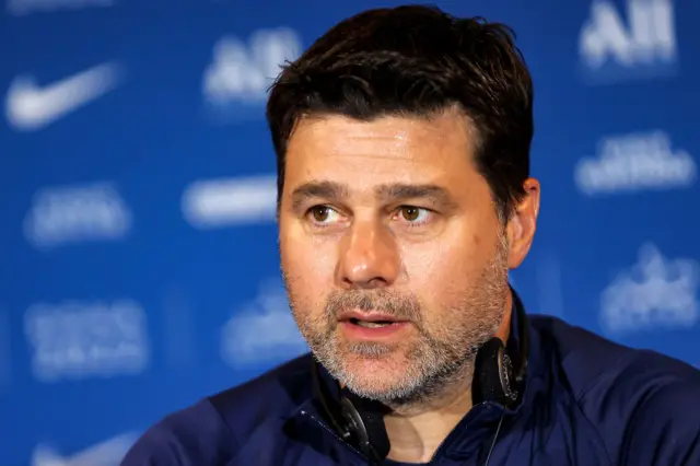 Mauricio Pochettino gives a news conference while PSG manager