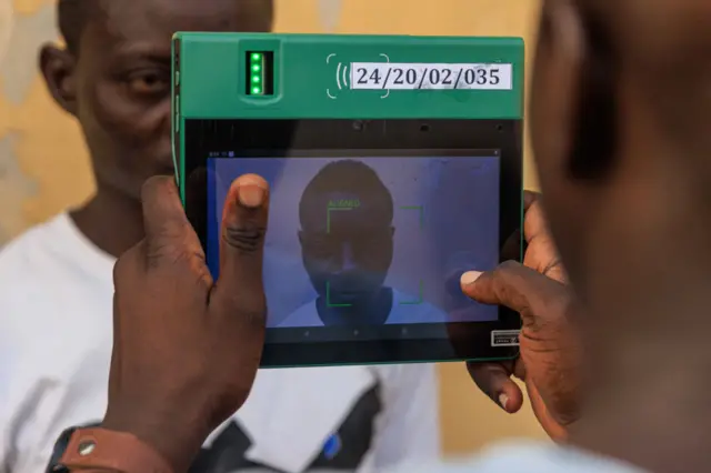 Independent National Electoral Commission (INEC) officials use the Bi-Modal Voter Accreditation System (BIVAS) to accredit voters during a mock accreditation exercise organised by INEC at Enitan Primary School at Surulere in Lagos, Nigeria, on 4 February.