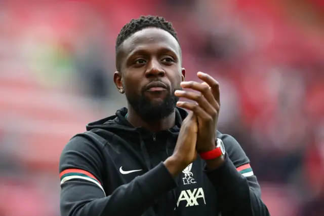 Liverpool's Divock Origi applauds the fans