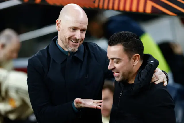 Manchester United manager Erik ten Hag with Barcelona boss Xavi