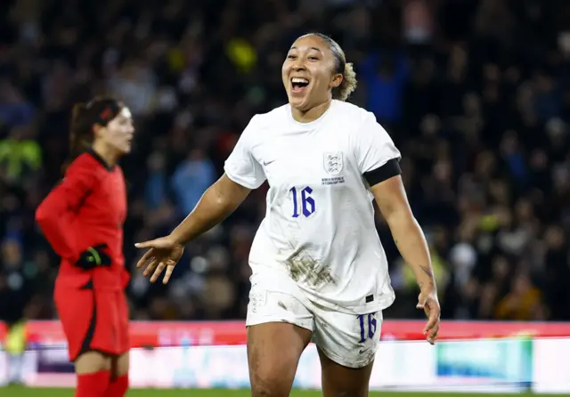 Lauren James celebrates scoring for England