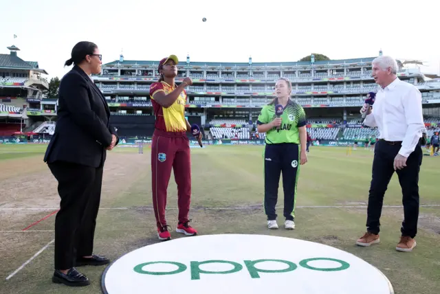 Hayley Matthews of West Indies flips the coin as Laura Delany of Ireland looks on ahead of the ICC Women's T20 World Cup group B match between West Indies and Ireland at Newlands Stadium