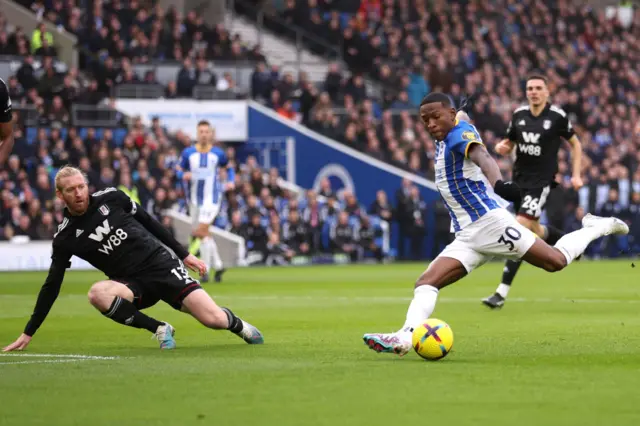 Pervis Estupinan shoots during the Premier League match between Brighton & Hove Albion and Fulham FC