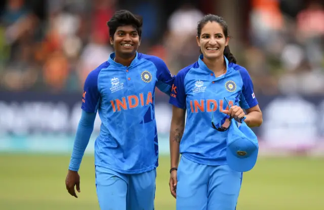 Renuka Thakur of India looks on alongside team mate Pooja Vastrakar after taking 5 wickets during the ICC Women's T20 World Cup group B match between England and India at St George's Park