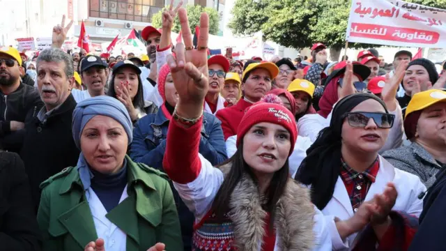 Members of Tunisian trade unions attend a rally organized by the Tunisian General Labor Union (UGTT) in Sfax