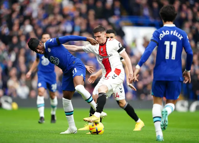 Chelsea's Noni Madueke and Southampton's Romain Perraud battle for the ball