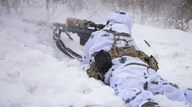 A Ukrainian sniper fires from a position around Bakhmut