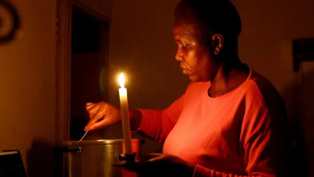 Maria Modiba cooks by a candlelight