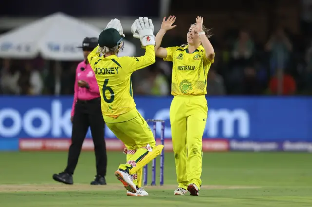 Georgia Wareham of Australia celebrates the wicket of Tazmin Brits of South Africa during the ICC Women's T20 World Cup group A match between South Africa and Australia