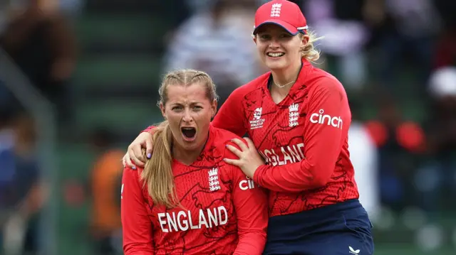 Sophie Ecclestone and Charlie Dean celebrate the wicket of India's Harmanpreet Kaur