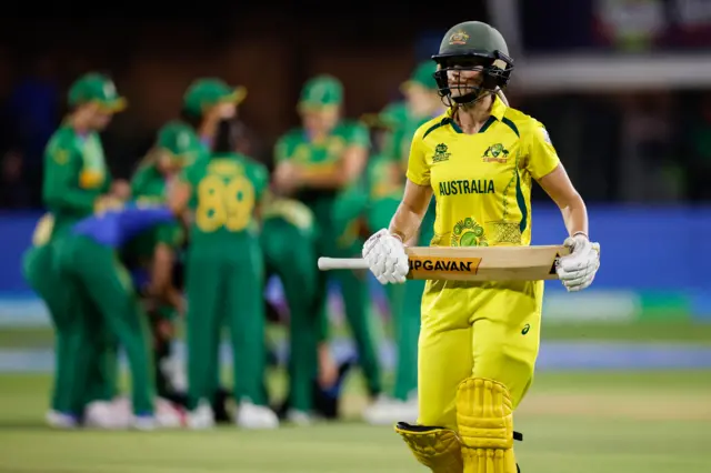 Ellyse Perry walks off after being dismissed