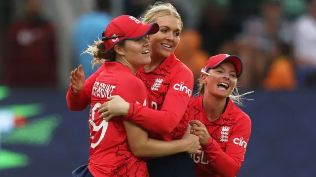 Sarah Glenn and England celebrate the wicket of Smriti Mandhana