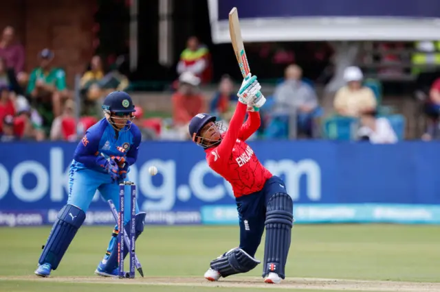 Sophia Dunkley of England is bowled by India's Renuka Singh Thakur