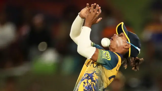 Nilakshi de Silva of Sri Lanka is hit in the face after dropping a catch off the batting of Suzie Bates of New Zealand during the ICC Women's T20 World Cup group A match between New Zealand and Sri Lanka at Boland Park