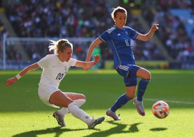 Katie Robinson of England crosses the ball against Italy