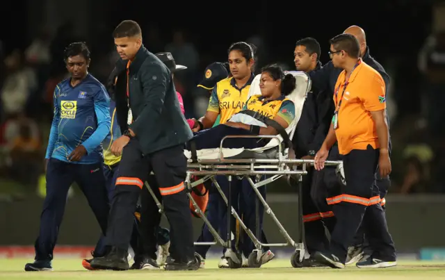 Achini Kulasuriya of Sri Lanka receives medical attention during the ICC Women's T20 World Cup group A match between New Zealand and Sri Lanka at Boland Park