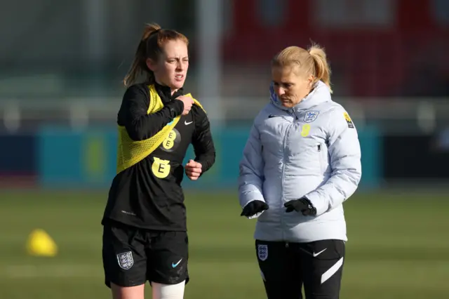 Keira Walsh and England head coach Sarina Wiegman.