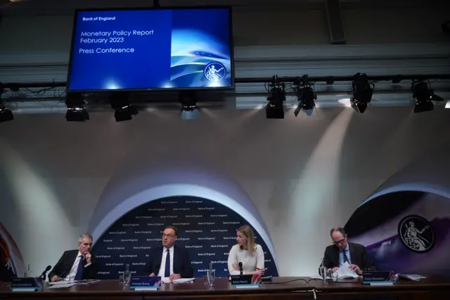 Ben Broadbent, Deputy Governor for Monetary Policy, Andrew Bailey, Governor of the Bank of England, Katie Martin, Head of Media and Stakeholder Engagement, and Deputy Governor for Markets and Banking Dave Ramsden, during the Bank of England Monetary Policy Report Press Conference, at the Bank of England