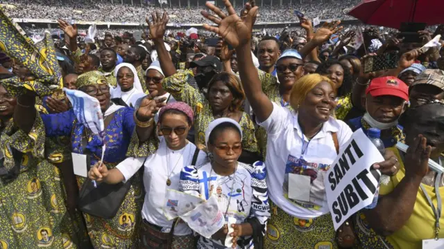 Faithfuls react during a meeting with Pope Francis at Martyrs' stadium in Kinshasa, Democratic Republic of Congo (DRC), 02 February 2023