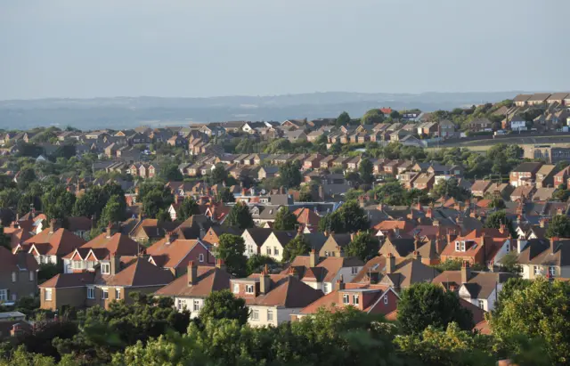 General view (GVs) of the rooftops of residential housing in Eastbourne, Sussex