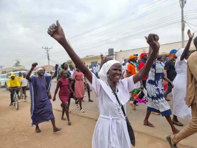 Woman raising her arms