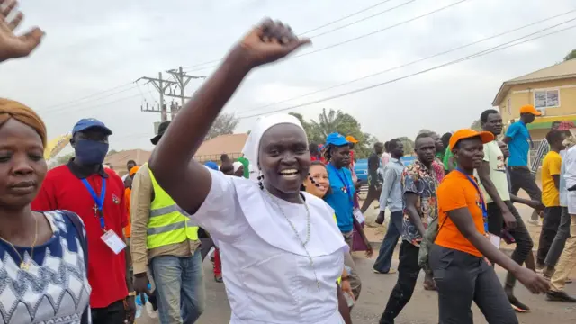 Woman raising her arms