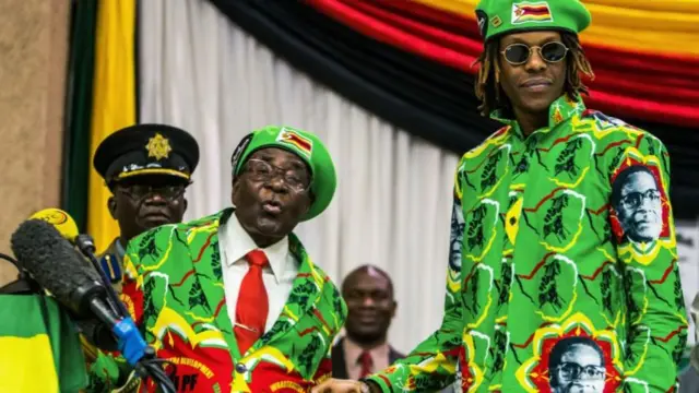 President Robert Mugabe (L) with his son (R) Robert Mugabe Junior